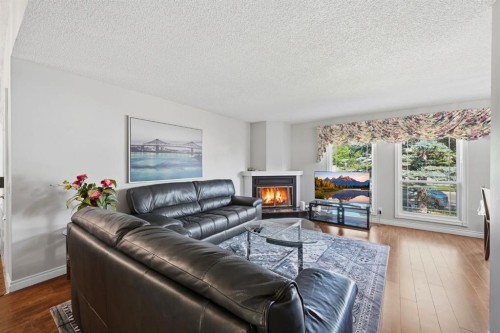 4 Fallswater Road Ne, Calgary, AB - Indoor Photo Showing Living Room With Fireplace