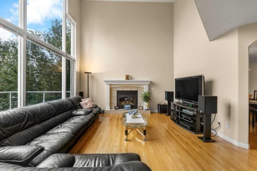 10413 Hamptons Boulevard Nw, Calgary, AB - Indoor Photo Showing Living Room With Fireplace
