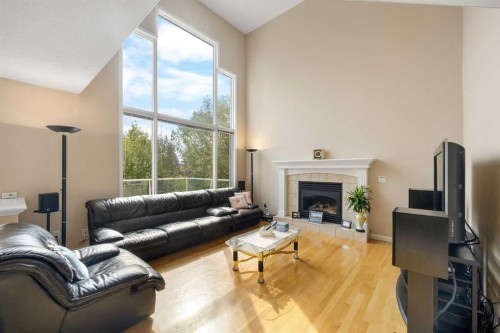 10413 Hamptons Boulevard Nw, Calgary, AB - Indoor Photo Showing Living Room With Fireplace