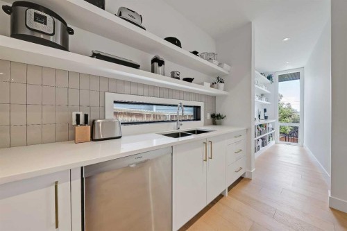 159 Rosery Drive Nw, Calgary, AB - Indoor Photo Showing Kitchen With Double Sink