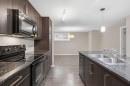 550 Mckenzie Towne Close Se, Calgary, AB  - Indoor Photo Showing Kitchen With Double Sink With Upgraded Kitchen 