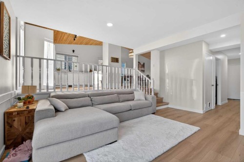 303 Woodside Place, Okotoks, AB - Indoor Photo Showing Living Room