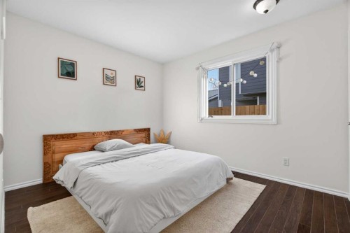 303 Woodside Place, Okotoks, AB - Indoor Photo Showing Bedroom