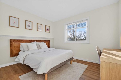 303 Woodside Place, Okotoks, AB - Indoor Photo Showing Bedroom
