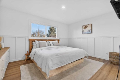 303 Woodside Place, Okotoks, AB - Indoor Photo Showing Bedroom