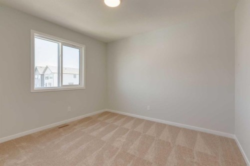 32 Ellen Lane, Crossfield, AB - Indoor Photo Showing Other Room