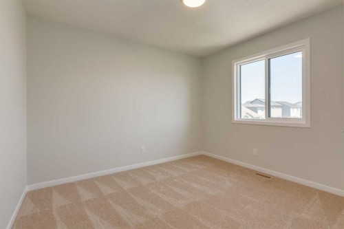 32 Ellen Lane, Crossfield, AB - Indoor Photo Showing Other Room