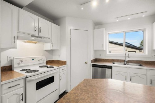 223 Coventry Road Ne, Calgary, AB - Indoor Photo Showing Kitchen With Double Sink
