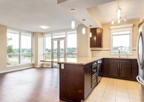 408-32 Varsity Estates Circle Nw, Calgary, AB - Indoor Photo Showing Kitchen With Double Sink With Upgraded Kitchen