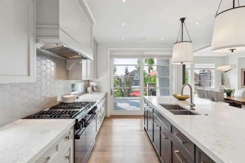 67 Aspen Ridge Square Sw, Calgary, AB - Indoor Photo Showing Kitchen With Double Sink With Upgraded Kitchen