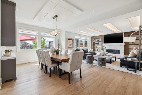 67 Aspen Ridge Square Sw, Calgary, AB - Indoor Photo Showing Dining Room With Fireplace