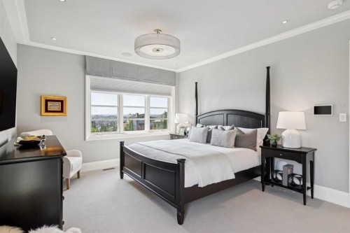 67 Aspen Ridge Square Sw, Calgary, AB - Indoor Photo Showing Bedroom