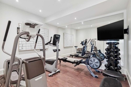 67 Aspen Ridge Square Sw, Calgary, AB - Indoor Photo Showing Gym Room