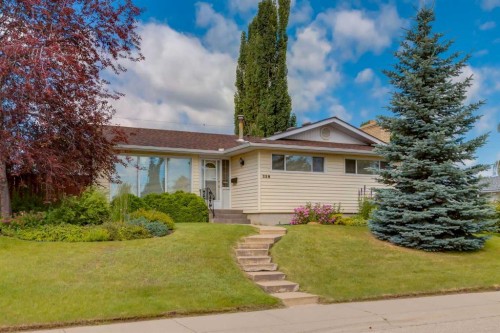 228 Maple Court Crescent Se, Calgary, AB - Outdoor With Facade