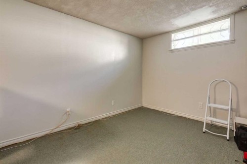 228 Maple Court Crescent Se, Calgary, AB - Indoor Photo Showing Other Room
