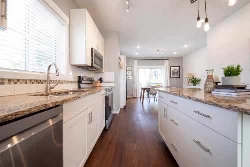 211 Copperpond Common Se, Calgary, AB - Indoor Photo Showing Kitchen With Double Sink With Upgraded Kitchen