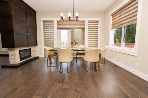 772 East Lakeview Road, Chestermere, AB - Indoor Photo Showing Dining Room With Fireplace