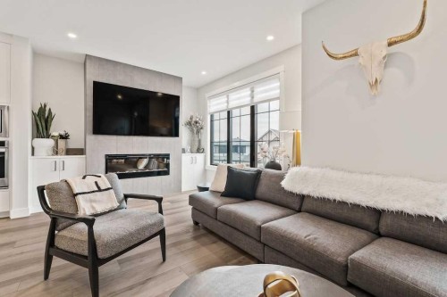138 Discovery Drive Sw, Calgary, AB - Indoor Photo Showing Living Room With Fireplace