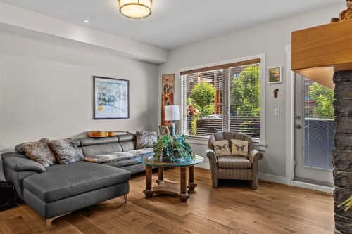 102-707 Spring Creek Drive, Canmore, AB - Indoor Photo Showing Living Room