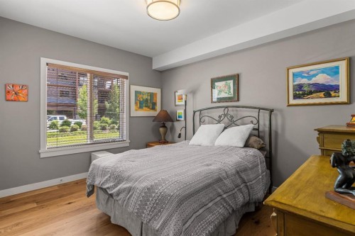 102-707 Spring Creek Drive, Canmore, AB - Indoor Photo Showing Bedroom