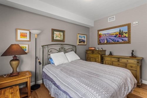 102-707 Spring Creek Drive, Canmore, AB - Indoor Photo Showing Bedroom