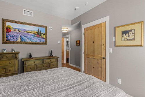 102-707 Spring Creek Drive, Canmore, AB - Indoor Photo Showing Bedroom