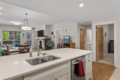 102-707 Spring Creek Drive, Canmore, AB - Indoor Photo Showing Kitchen With Double Sink