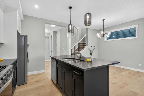 120 Southbow Avenue, Cochrane, AB - Indoor Photo Showing Kitchen With Double Sink With Upgraded Kitchen