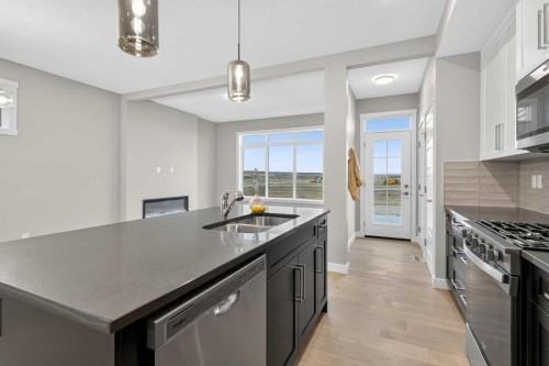 120 Southbow Avenue, Cochrane, AB - Indoor Photo Showing Kitchen With Double Sink With Upgraded Kitchen
