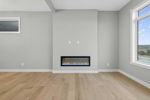 120 Southbow Avenue, Cochrane, AB - Indoor Photo Showing Other Room With Fireplace