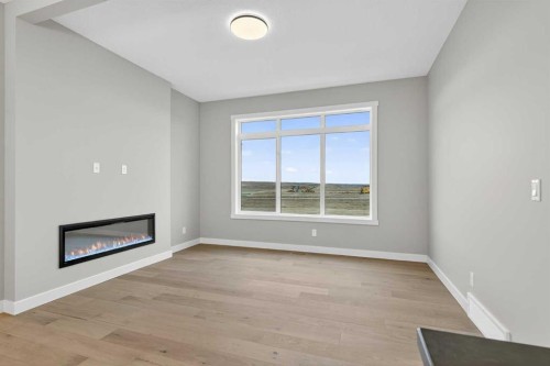 120 Southbow Avenue, Cochrane, AB - Indoor With Fireplace