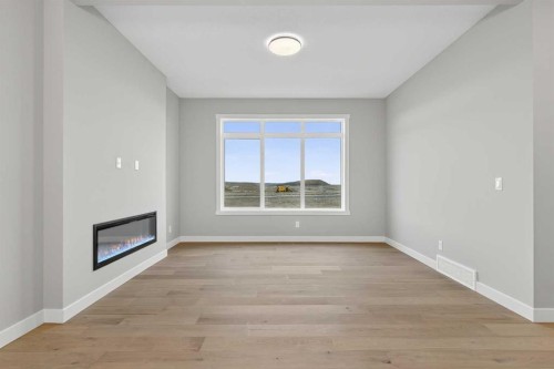 120 Southbow Avenue, Cochrane, AB - Indoor Photo Showing Other Room With Fireplace