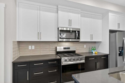 120 Southbow Avenue, Cochrane, AB - Indoor Photo Showing Kitchen With Upgraded Kitchen