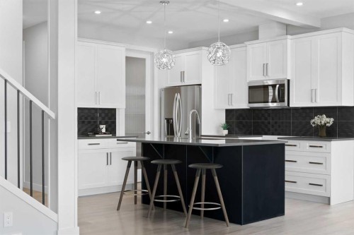 67 Agate Road, Cochrane, AB - Indoor Photo Showing Kitchen With Upgraded Kitchen