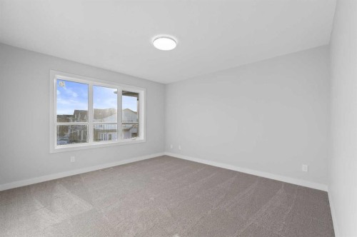 67 Agate Road, Cochrane, AB - Indoor Photo Showing Other Room