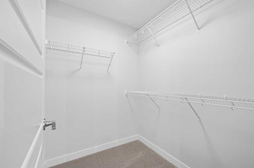 67 Agate Road, Cochrane, AB - Indoor With Storage