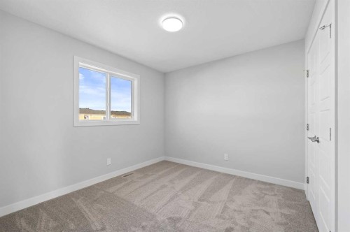 67 Agate Road, Cochrane, AB - Indoor Photo Showing Other Room