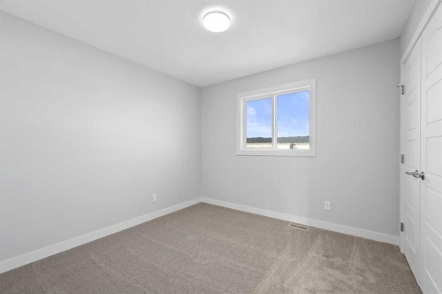 67 Agate Road, Cochrane, AB - Indoor Photo Showing Other Room