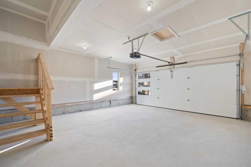 67 Agate Road, Cochrane, AB - Indoor Photo Showing Garage