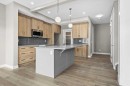 67 Agate Road, Cochrane, AB  - Indoor Photo Showing Kitchen With Upgraded Kitchen 