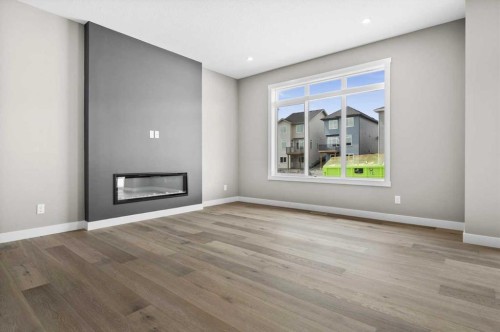 67 Agate Road, Cochrane, AB - Indoor Photo Showing Living Room With Fireplace
