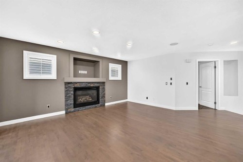 98 Panamount Villas Nw, Calgary, AB - Indoor Photo Showing Living Room With Fireplace