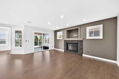 98 Panamount Villas Nw, Calgary, AB - Indoor Photo Showing Living Room With Fireplace