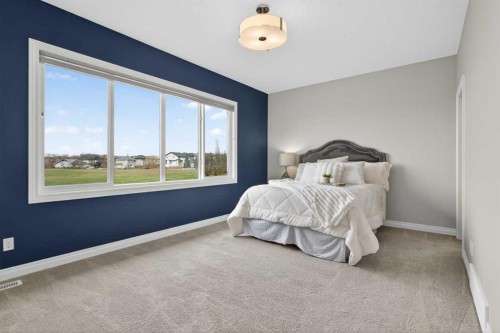73 Rockyvale Green Nw, Calgary, AB - Indoor Photo Showing Bedroom