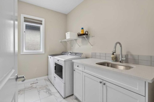 73 Rockyvale Green Nw, Calgary, AB - Indoor Photo Showing Laundry Room
