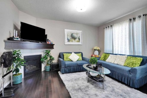 1239 Brightoncrest Green Se, Calgary, AB - Indoor Photo Showing Living Room With Fireplace