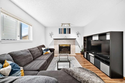 3628 Catalina Boulevard Ne, Calgary, AB - Indoor Photo Showing Living Room With Fireplace