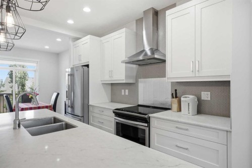 611-355 Nolancrest Heights Nw, Calgary, AB - Indoor Photo Showing Kitchen With Stainless Steel Kitchen With Double Sink With Upgraded Kitchen