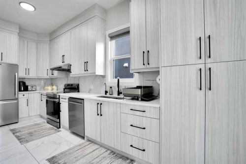 36 Waterford Terrace, Chestermere, AB - Indoor Photo Showing Kitchen With Stainless Steel Kitchen With Double Sink