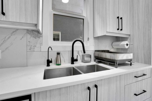 36 Waterford Terrace, Chestermere, AB - Indoor Photo Showing Kitchen With Double Sink